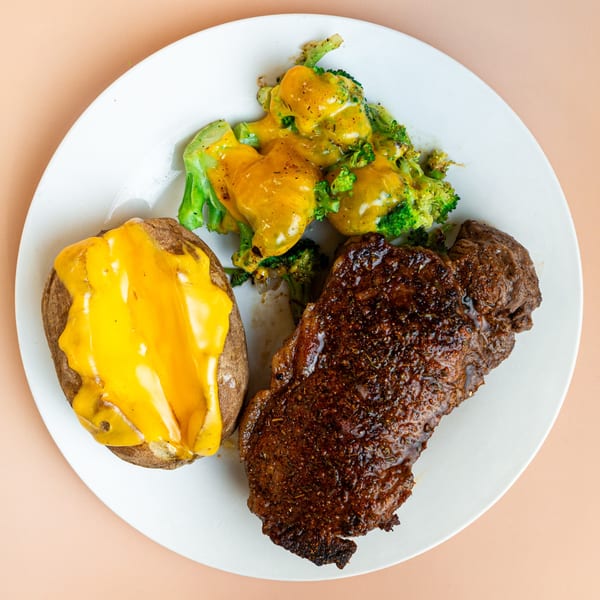 Pinegrove Market & Deli's steak dinner with a loaded baked potato and cheesy broccoli.